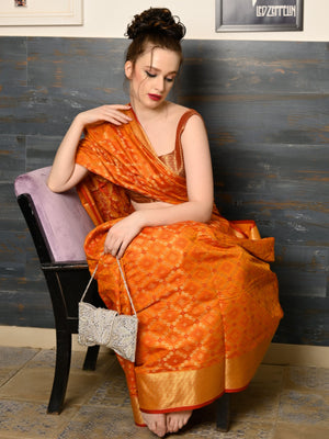 Rajwada Women Festive Orange Silk Blend Woven Saree With Unstitched Blouse