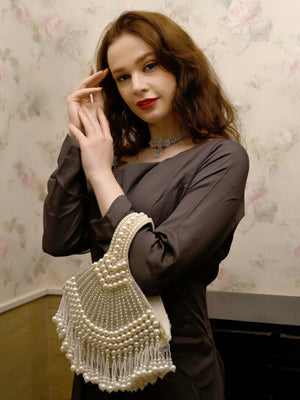 Rajwada Women All Pearls Tasselled White Clutch