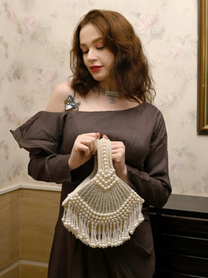 Rajwada Women All Pearls Tasselled White Clutch