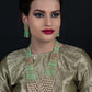 Flaunting green beads and pearl necklace - Rajwada