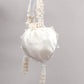 IMPRESSIVE WHITE EMBELLISHED POTLI BAG - Rajwada