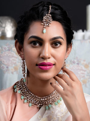 Supple Clear Stone-Green Mani Copper Tone Necklace Set - Rajwada