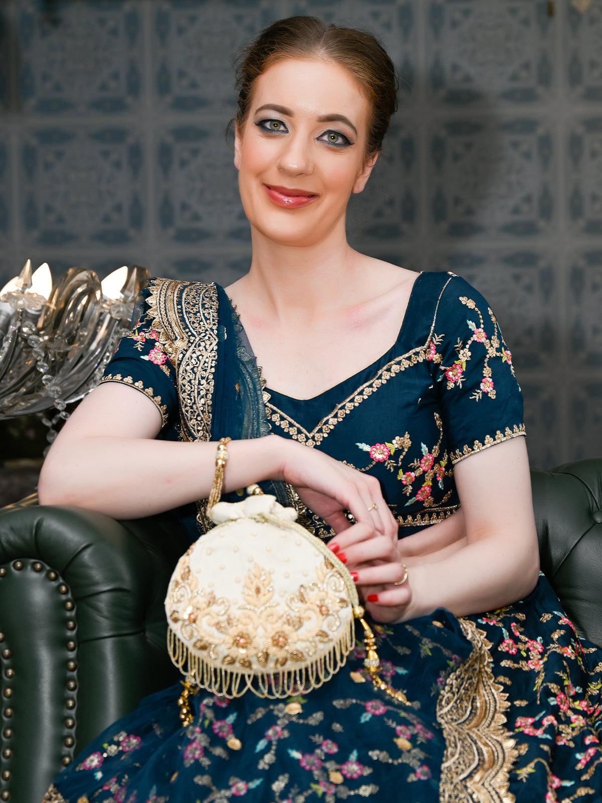THE VERY STYLISH BEIGE POTLI BAG - Odette