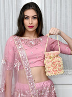 THE VERY STYLISH PEACH POTLI BAG - Odette